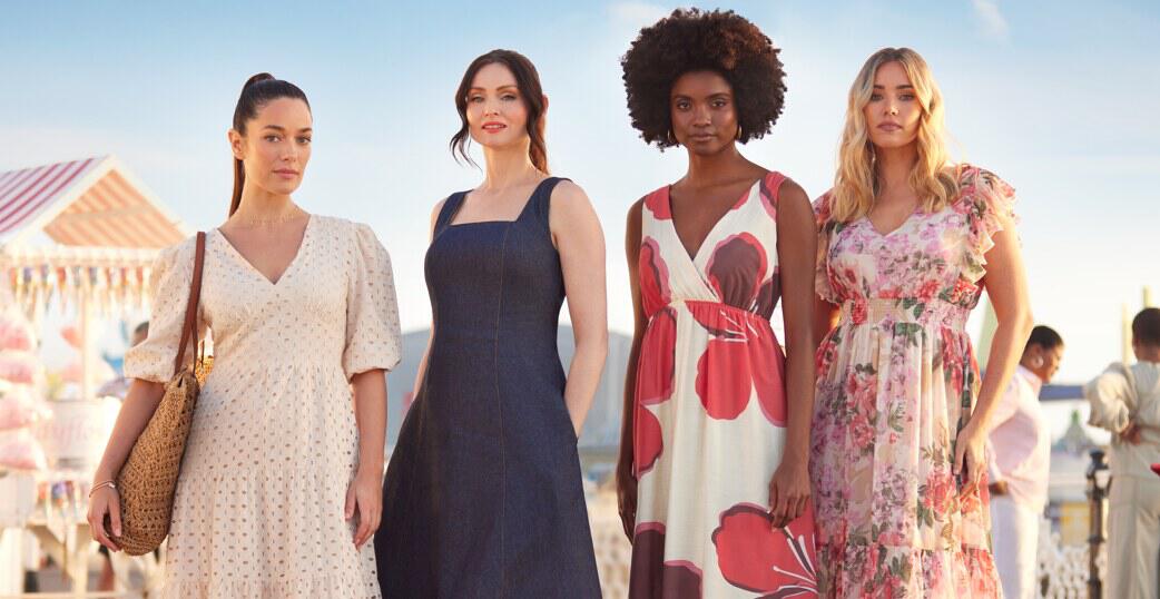 Freeman savings tips banner - 4 woman in summer clothing on a pier with blue sky behind