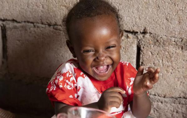 Save the Children smile image showing a happy child