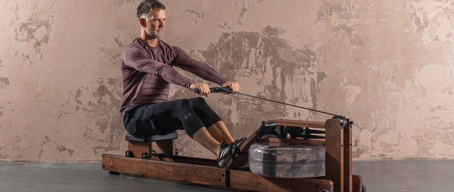 WaterRower more ways to save banner featuring man using a rowing machine in a warehouse space